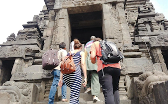 Visitors ascending steps at Prambanan Temple, Indonesia, during the Ultimate Temple Run tour.