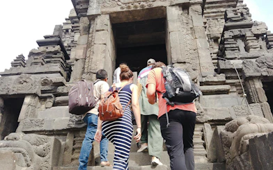 Visitors ascending steps at Prambanan Temple, Indonesia, during the Ultimate Temple Run tour.