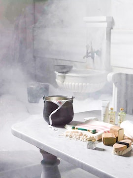 Turkish bath essentials on marble table with steam in Istanbul.