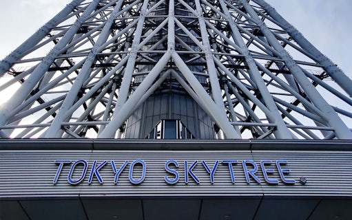 Tokyo Skytree structure with signage, part of Sky Hop Bus tour.