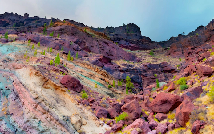 Colorful volcanic rock formations of Los Azulejos de Veneguera in Gran Canaria, Spain.