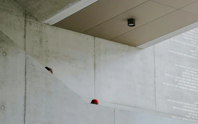 Concrete interior of Kunsthaus Museum Zürich with partial view of a person on stairs.