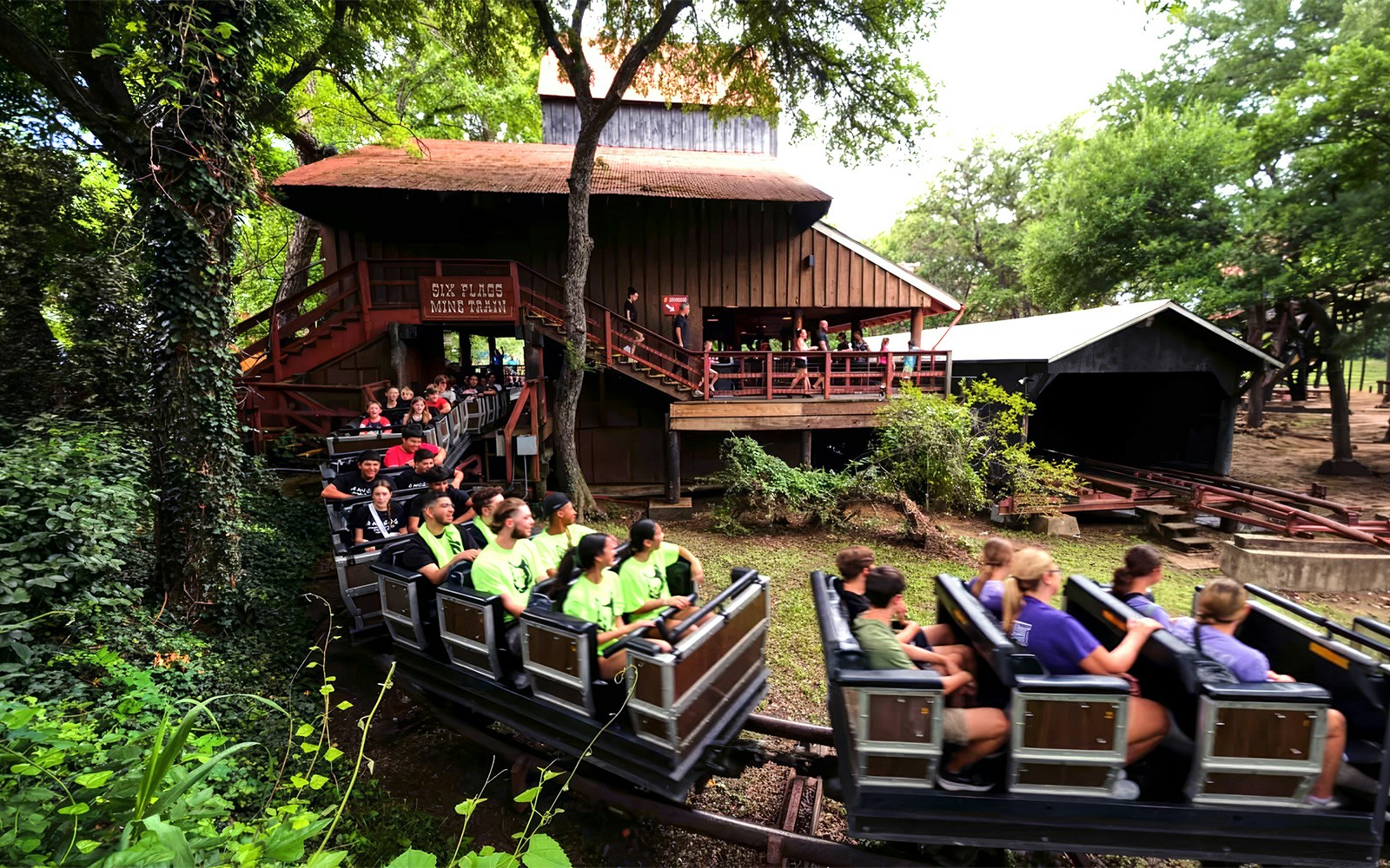 Visitors riding the Runaway Mine Train at Six Flags Over Texas.
