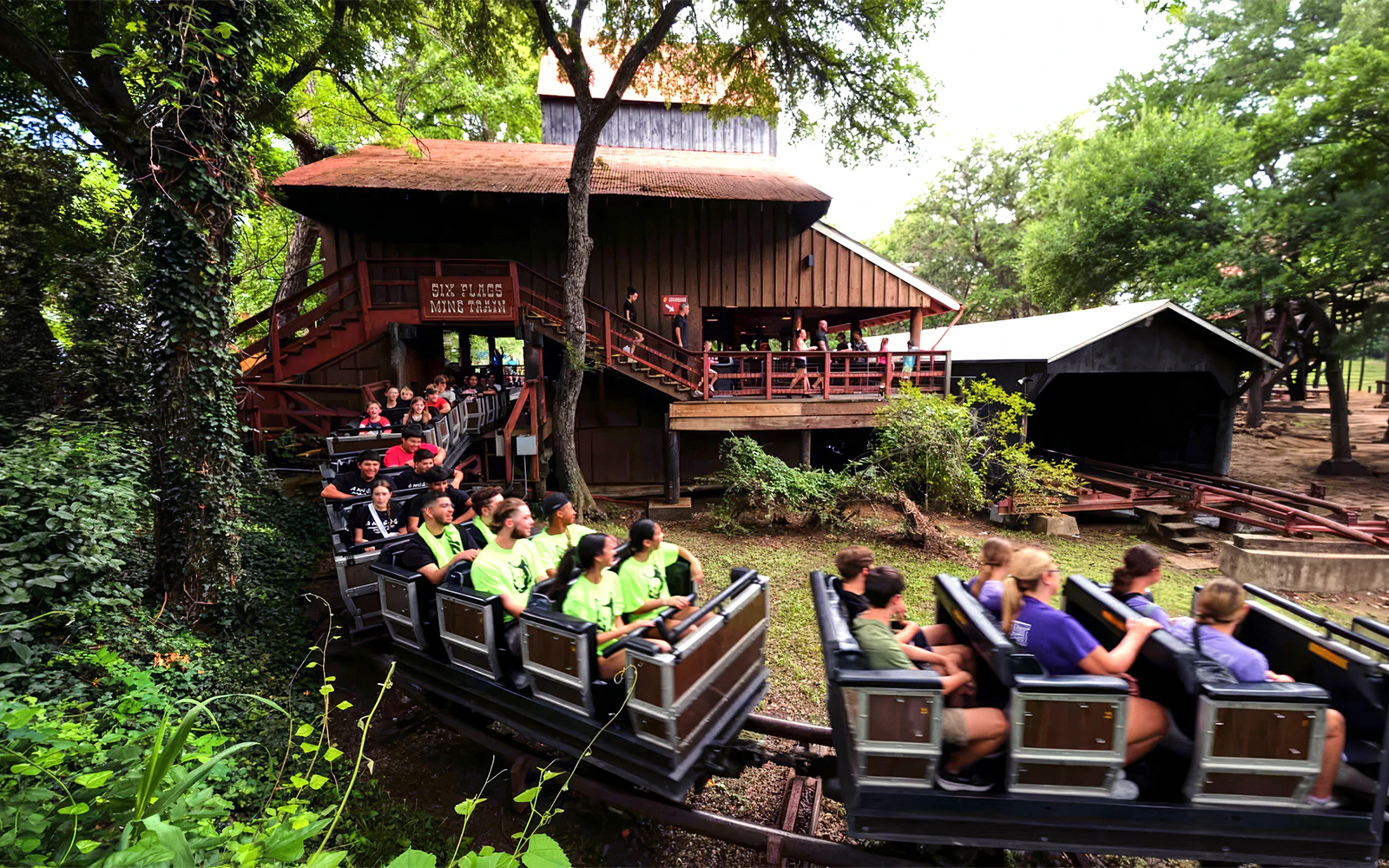 Visitors riding the Runaway Mine Train at Six Flags Over Texas.