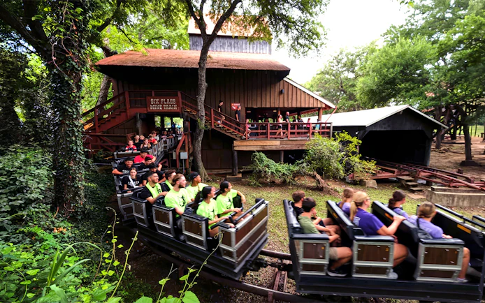 Visitors riding the Runaway Mine Train at Six Flags Over Texas.