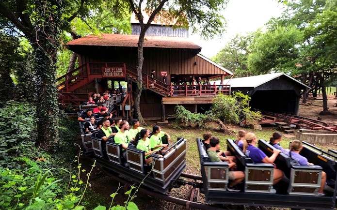 Visitors riding the Runaway Mine Train at Six Flags Over Texas.