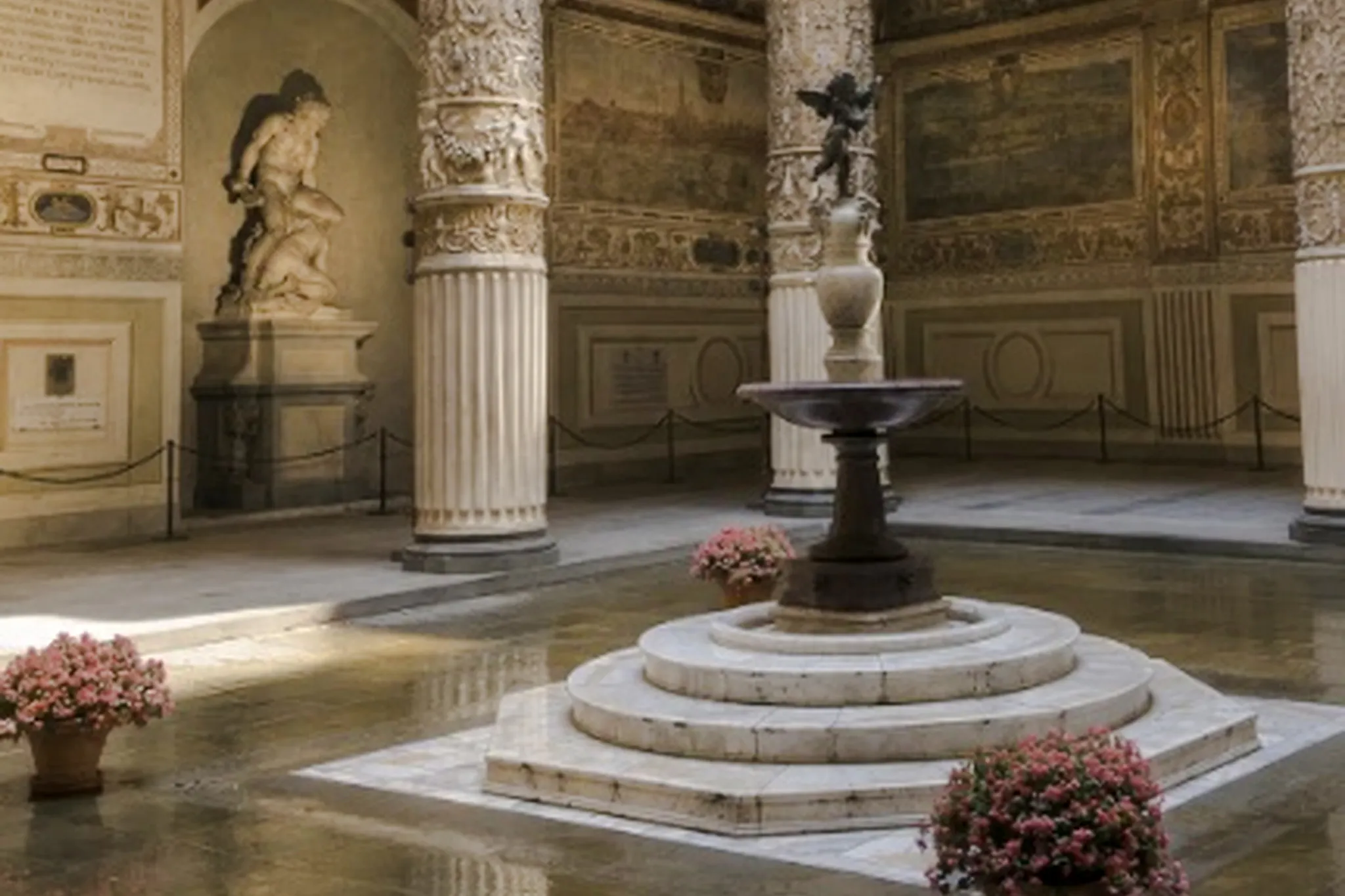 Palazzo Vecchio courtyard with ornate columns and central fountain, Rome tour.