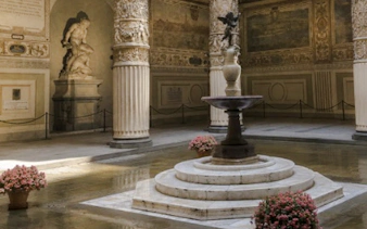 Palazzo Vecchio courtyard with ornate columns and central fountain, Rome tour.