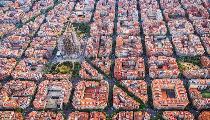 Aerial view of Barcelona's Eixample district with Sagrada Familia in the center.