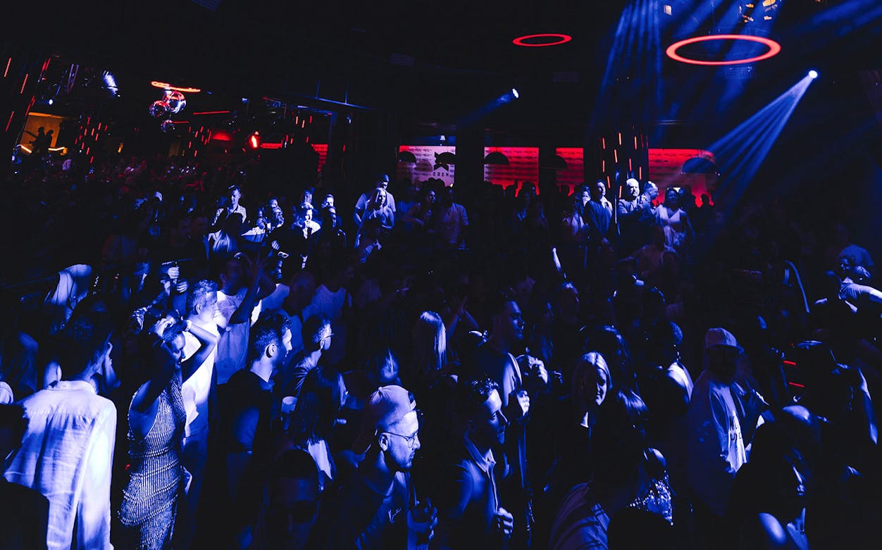 Crowd enjoying a vibrant night at Eden on Sundays event with dynamic lighting.