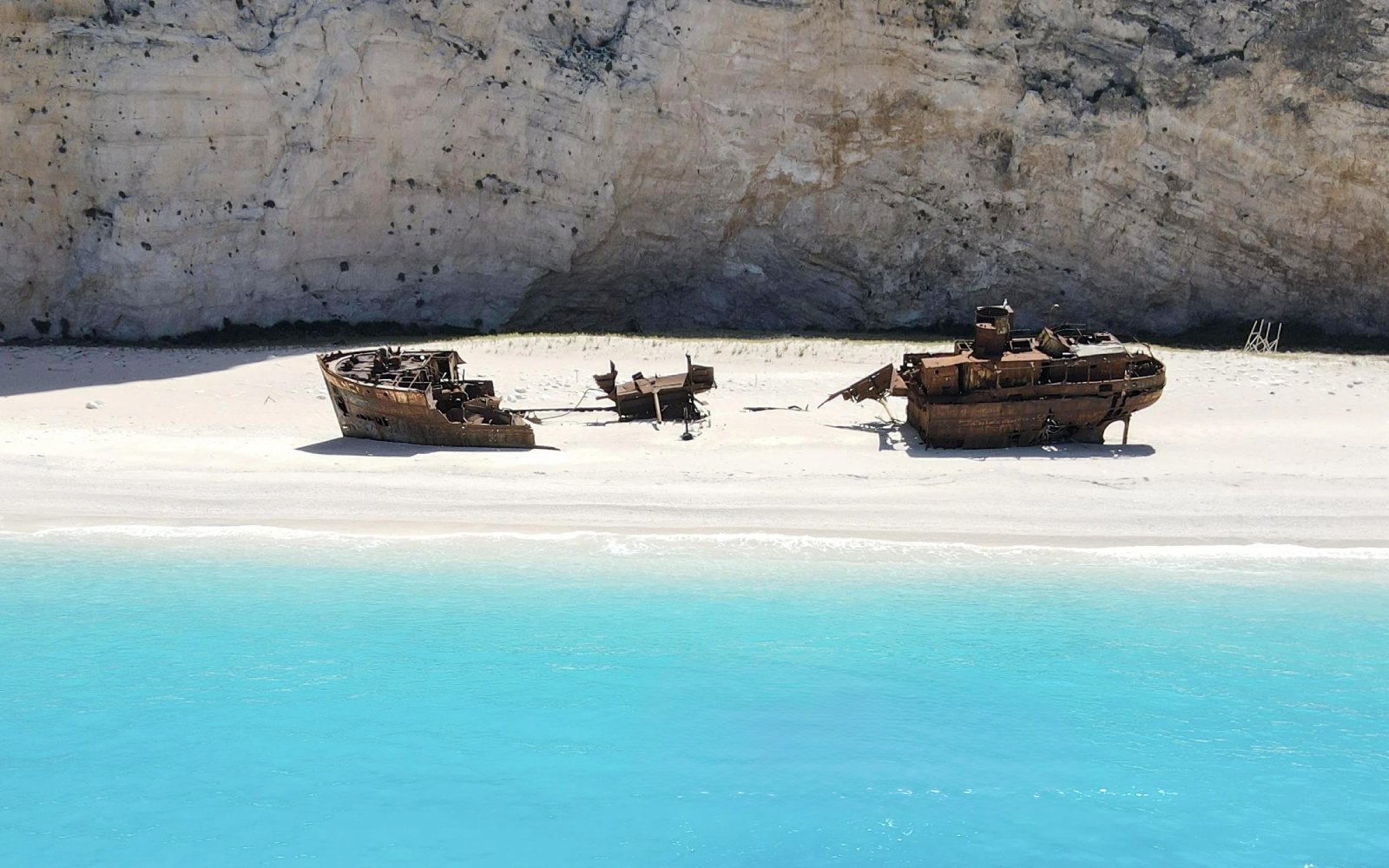 Shipwreck on Navagio Beach, Zakynthos, Greece, with turquoise water and cliffs in the background.