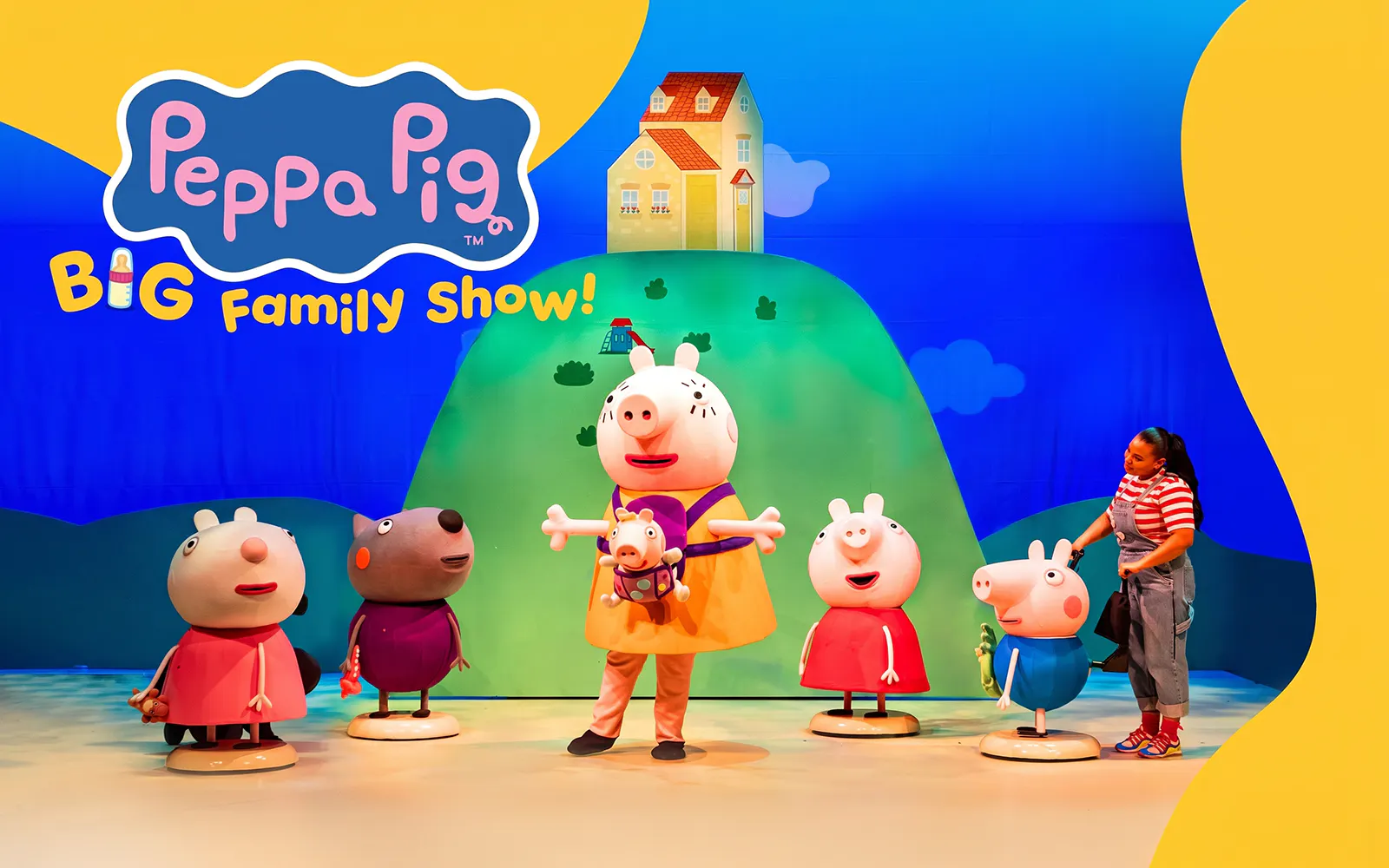 Peppa Pig characters on stage with colorful backdrop at Big Family Show.