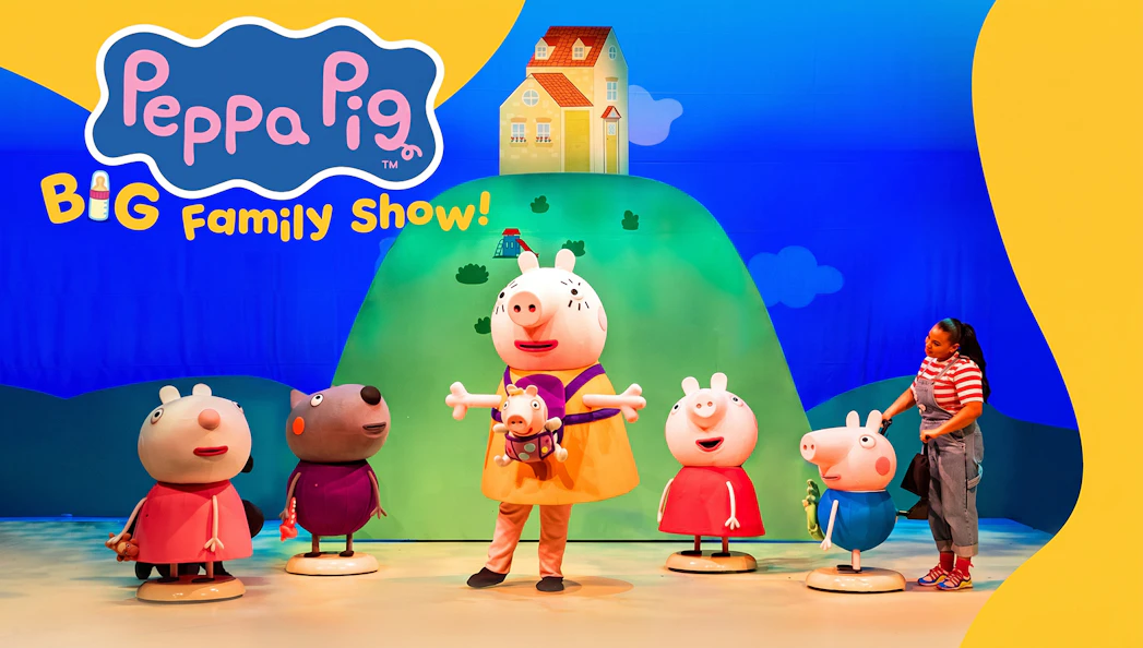 Peppa Pig characters on stage with colorful backdrop at Big Family Show.