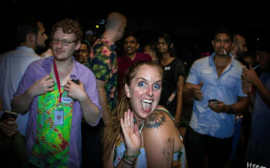 Group enjoying nightlife pub crawl in Dubai with lively atmosphere.