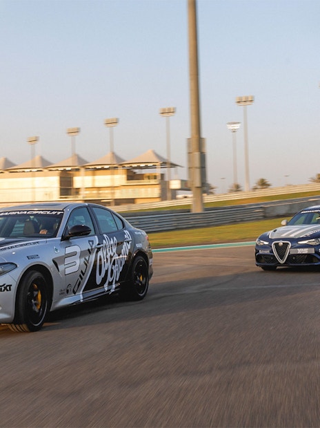 Alfa Romeo Giulia Quadrifoglio cars racing at Yas Marina Circuit.