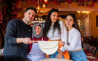 Group making traditional flatbread on Istanbul food tour.