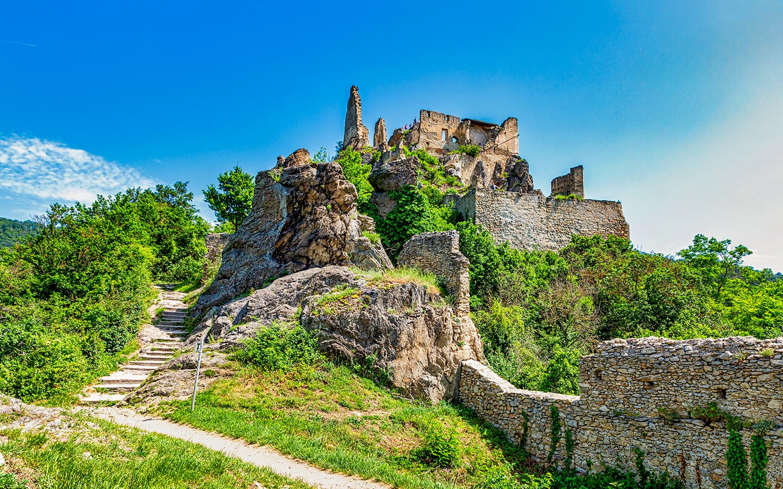 Ruins of Dürnstein Castle in Danube Valley, Austria, surrounded by greenery.