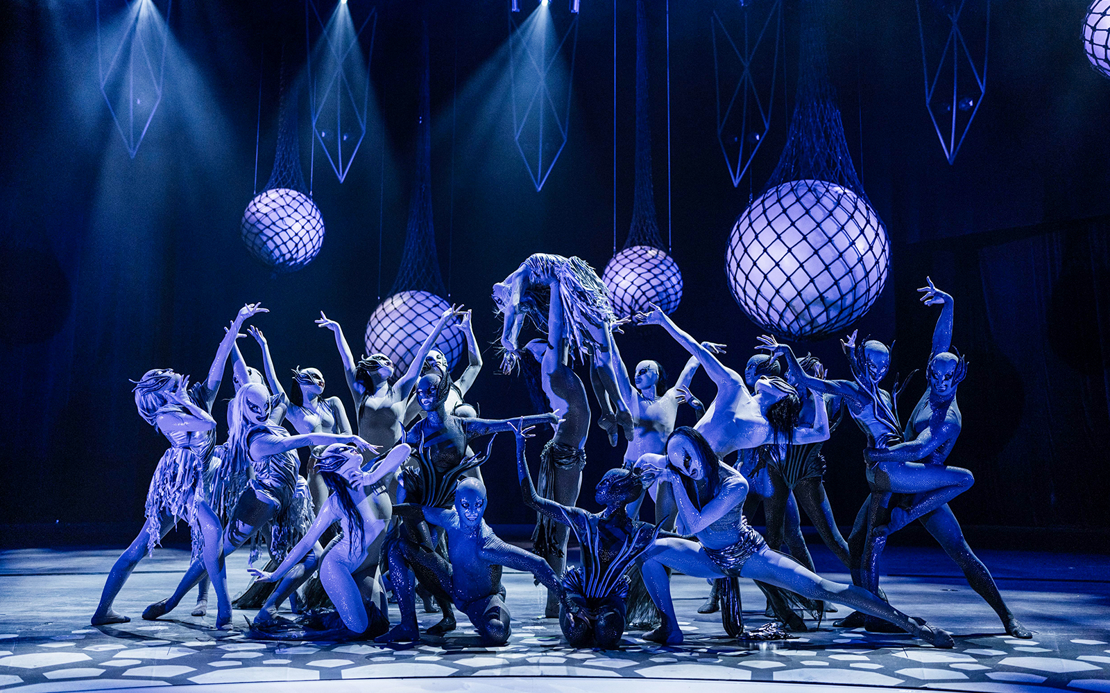 Performers in elaborate costumes on stage at FALLING | IN LOVE Grand Show.