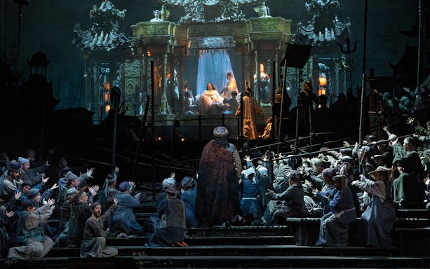 Opera performance of Turandot with elaborate stage set and performers in traditional costumes.