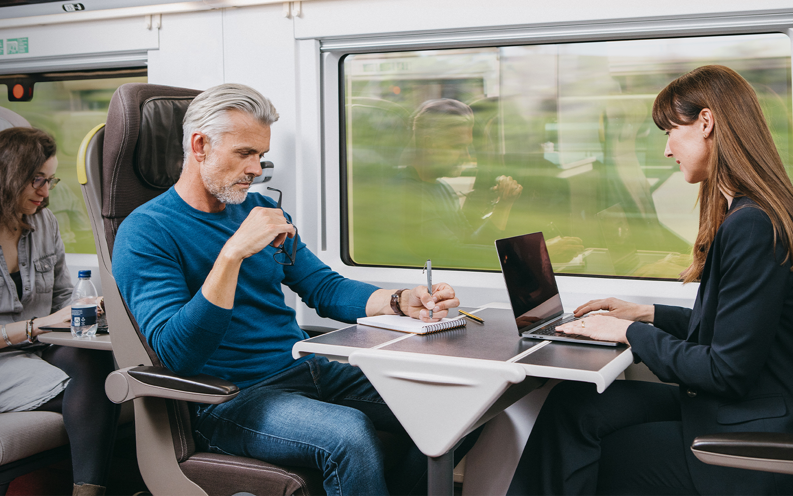 Passengers seated in Eurostar train Standard Premier cabin