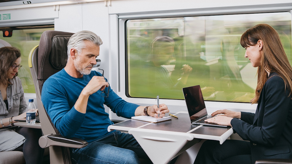 Passengers seated in Eurostar train Standard Premier cabin