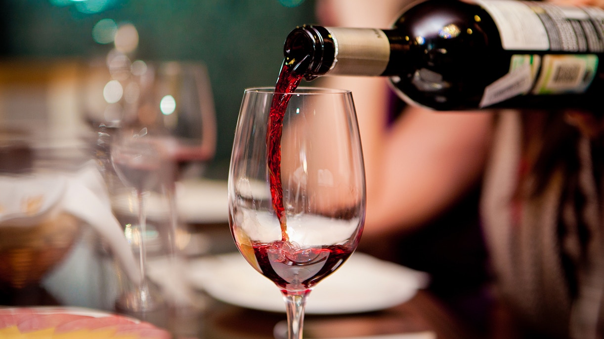 Wine glasses on a table in a restaurant.