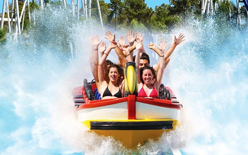 Visitors enjoying water slides at Aquashow Park, Portimão, Portugal.