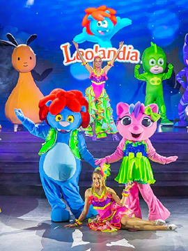 Colorful characters and performers on stage at Leolandia theme park.