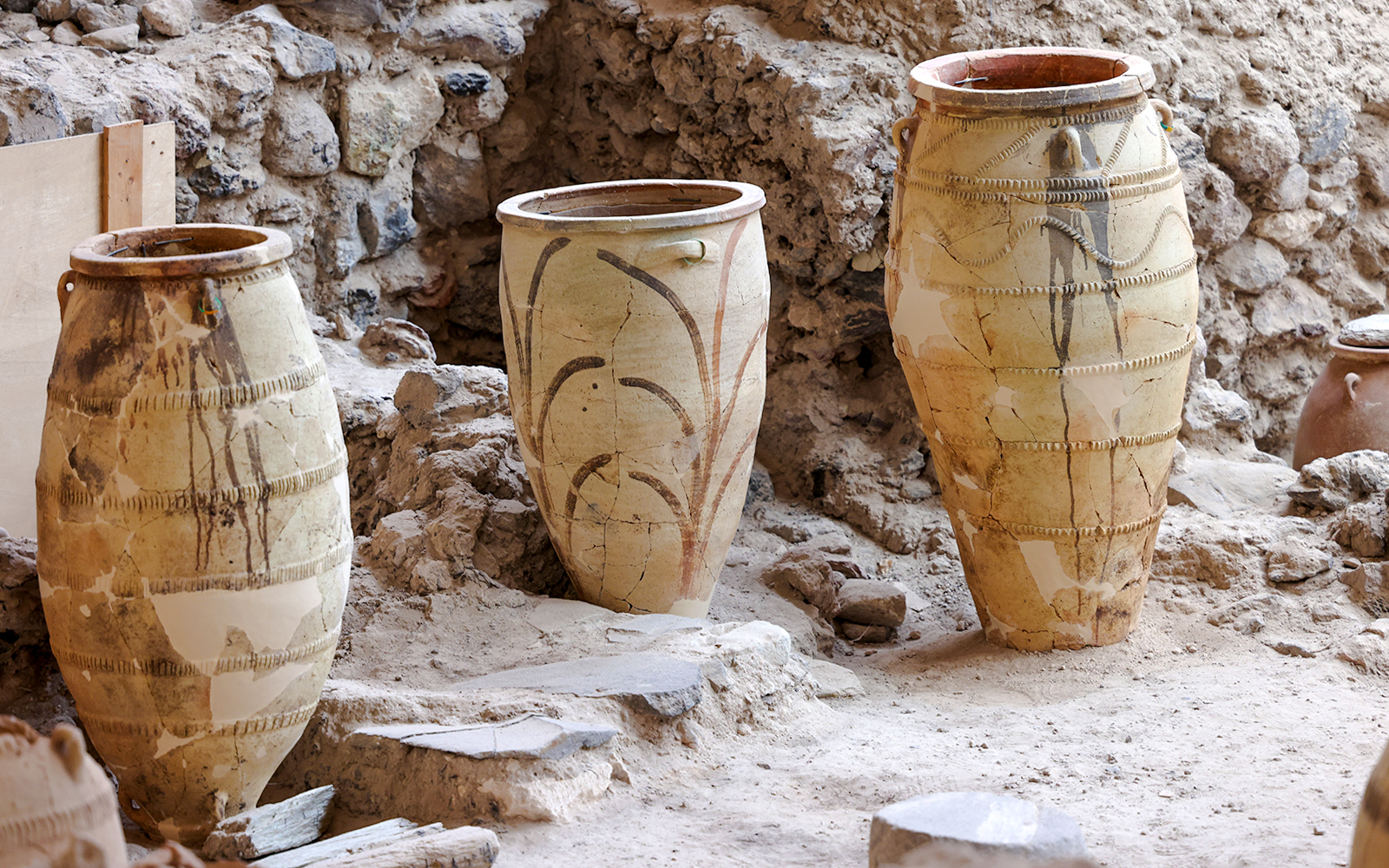 Ancient pottery jars in the ruins of Akrotiri, Santorini.