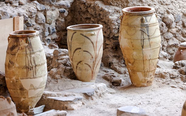 Ancient pottery jars in the ruins of Akrotiri, Santorini.