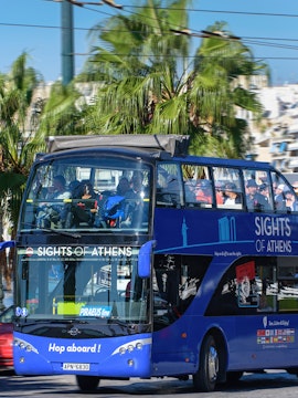 Open-top tour bus in Athens offering hop-on hop-off sightseeing.