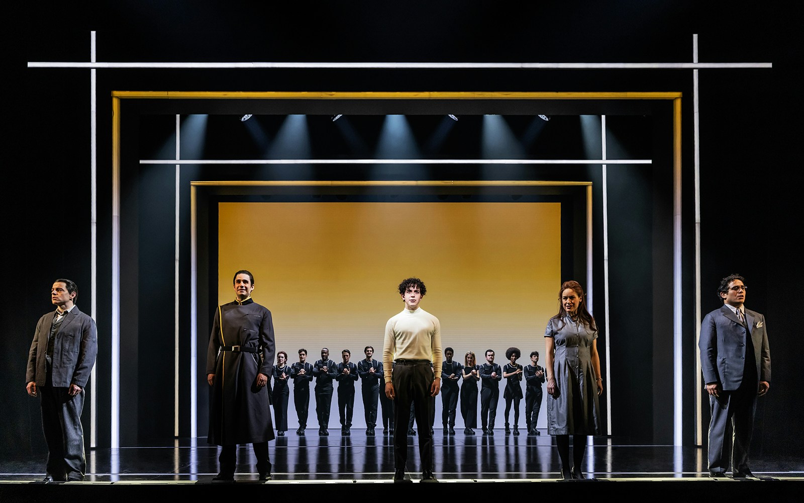 Cast performing on stage in "The Who’s Tommy" musical.
