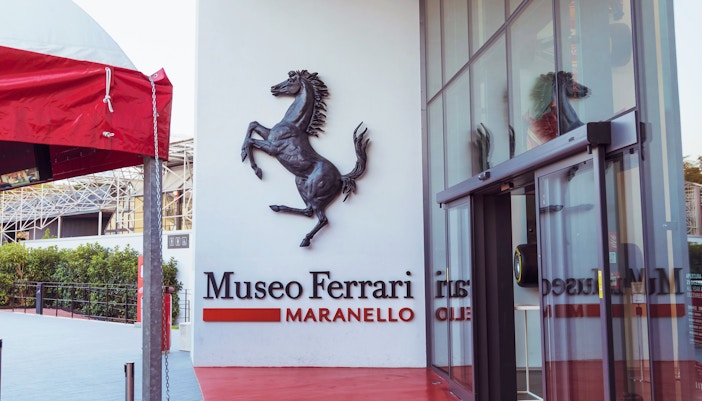 Entrance of the Ferrari Museum in Maranello with prancing horse logo.
