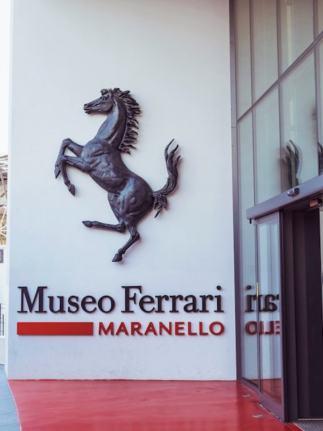 Entrance of the Ferrari Museum in Maranello with prancing horse logo.