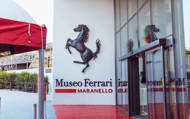 Entrance of the Ferrari Museum in Maranello with prancing horse logo.