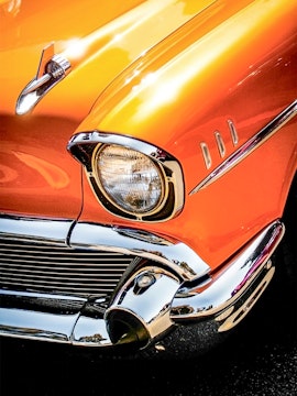 Classic orange car front detail at Malta Classic Car Collection.