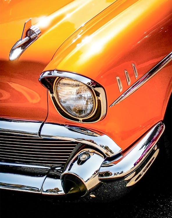 Classic orange car front detail at Malta Classic Car Collection.
