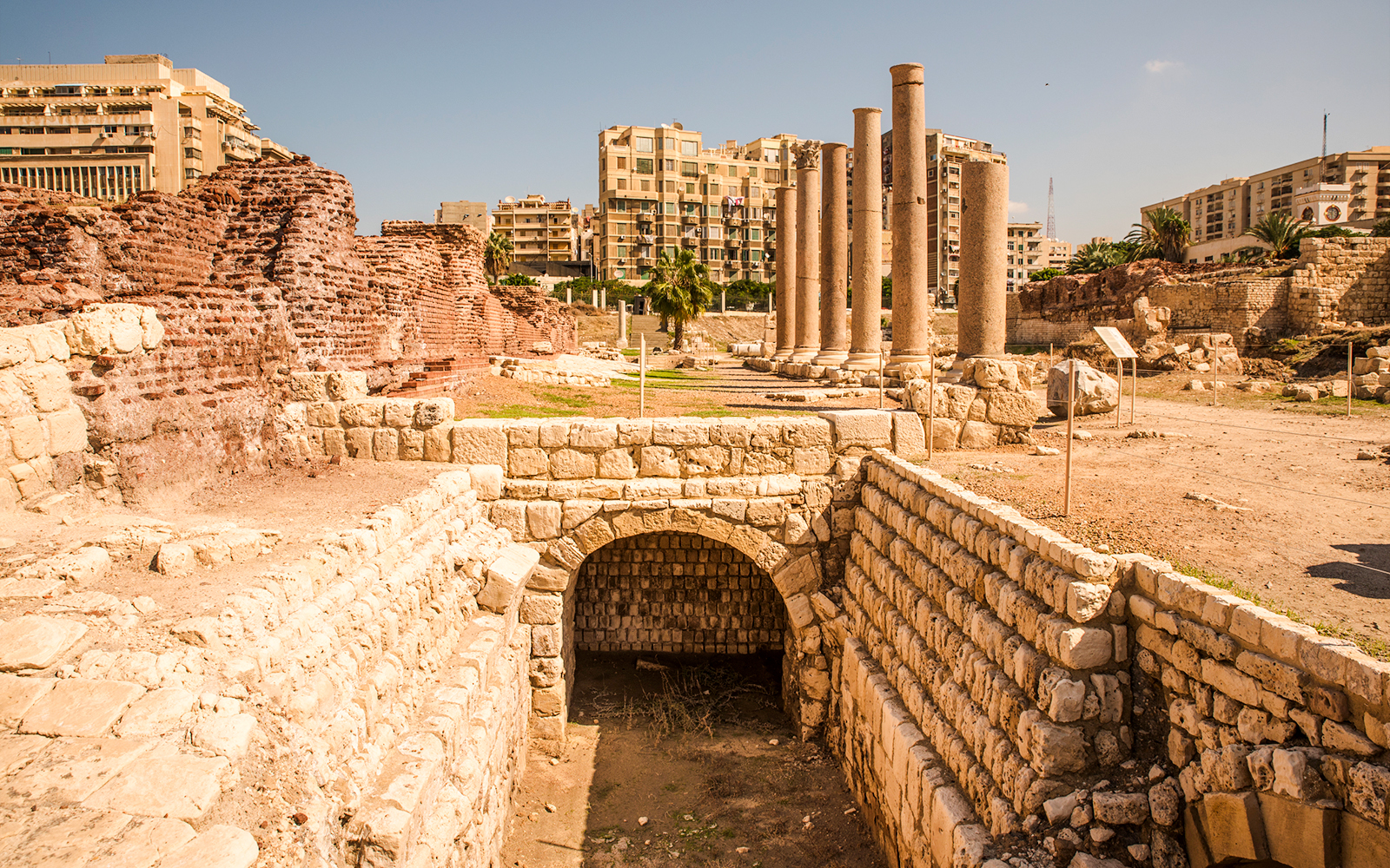 Roman ruins with columns and ancient stone structures in Cairo, Egypt.
