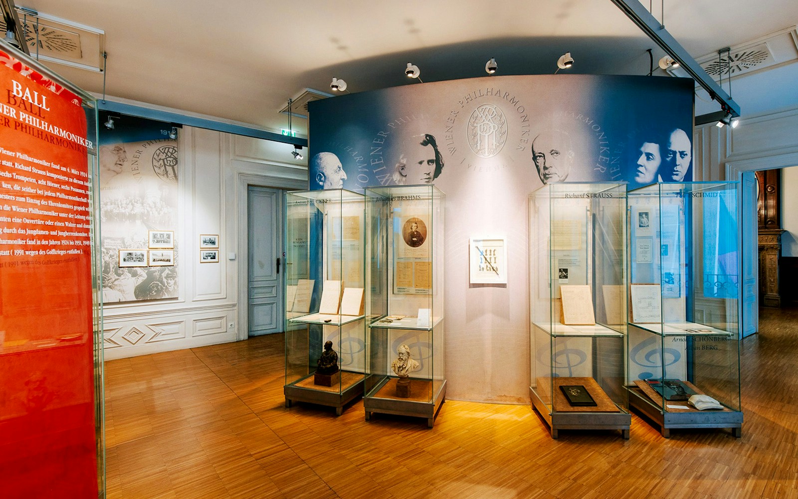 Exhibit displays at Haus der Musik featuring historical music documents and composer portraits.