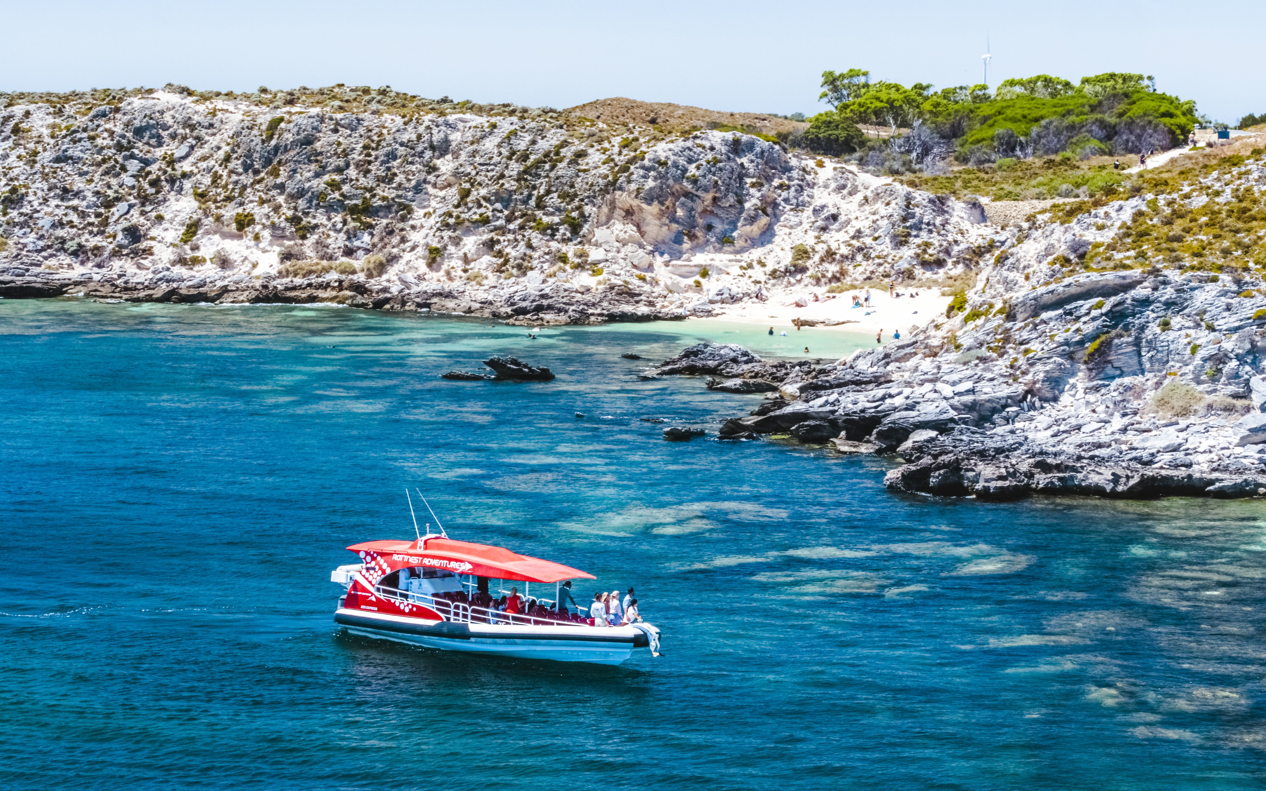 #Snorkel tour boat near rocky coastline and beach, Perth/Fremantle.