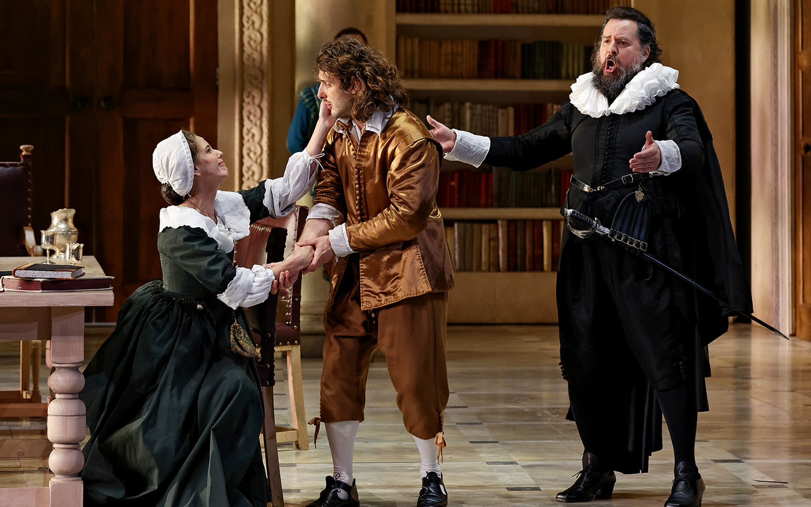 Opera performers in period costumes during a scene from The Marriage of Figaro.