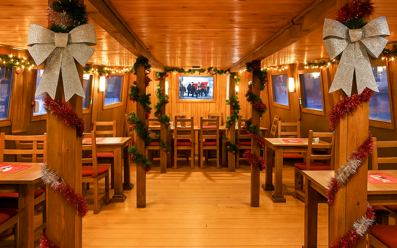 Interior of Advent Cruise in Prague decorated with festive garlands and bows.