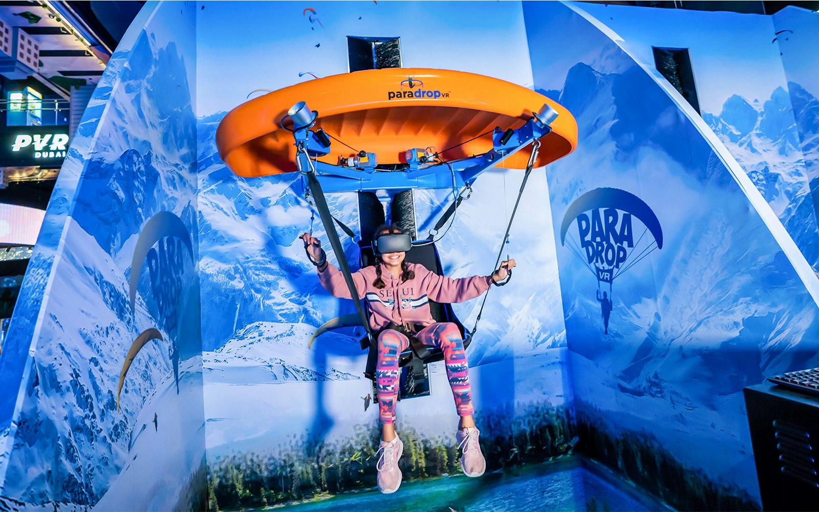 VR Park Dubai interior with virtual reality gaming stations and visitors engaging in immersive experiences.