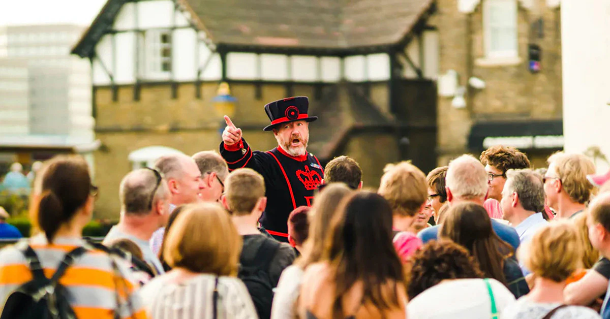 Beefeater leading a tour group at the Tower of London.