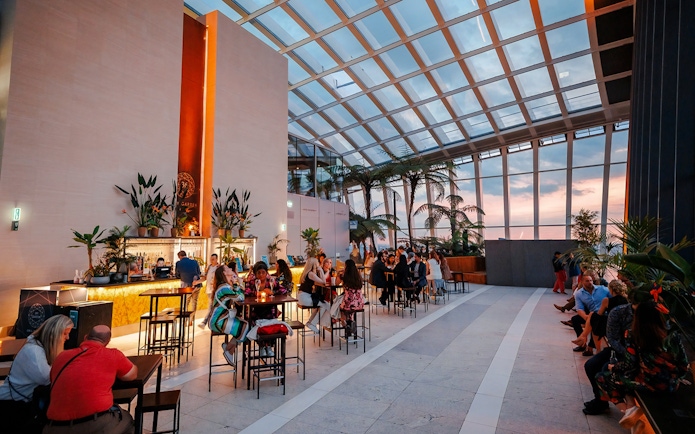 Guests enjoying Music Night at Sky Garden with sunset views.