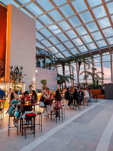 Guests enjoying Music Night at Sky Garden with sunset views.