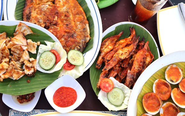 Balinese seafood dishes with grilled fish, prawns, and clams at Kekeb Cooking Class, Nusa Dua.