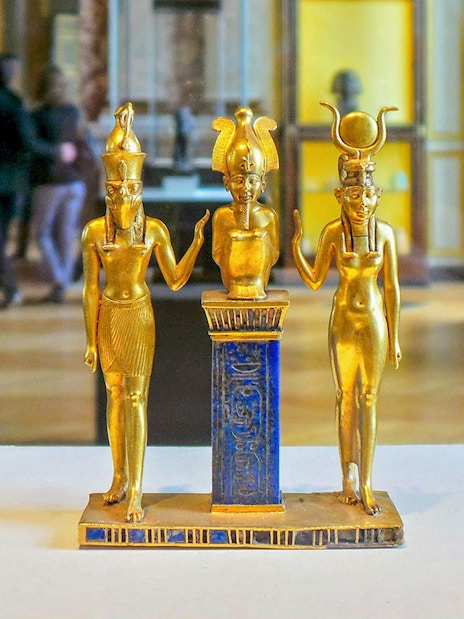 Golden Egyptian statues on display at the National Museum of Egyptian Civilization in Cairo.