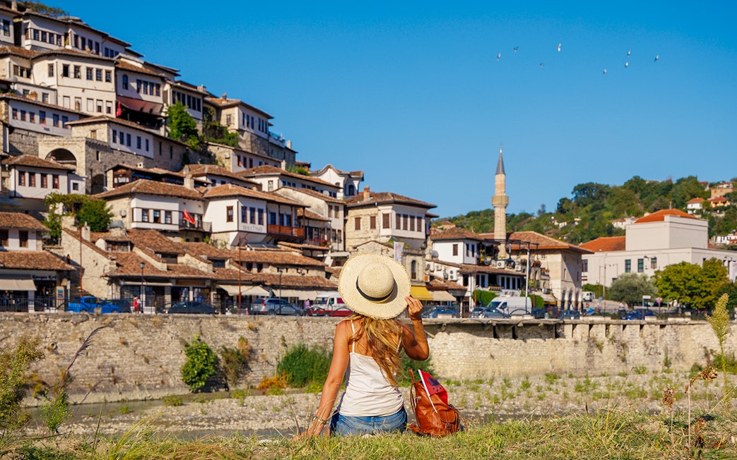 Guests exploring Berat's historic hillside houses and mosque.