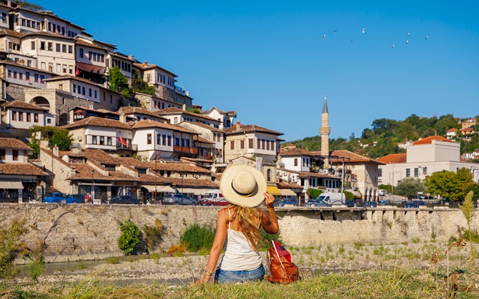 Guests exploring Berat's historic hillside houses and mosque.